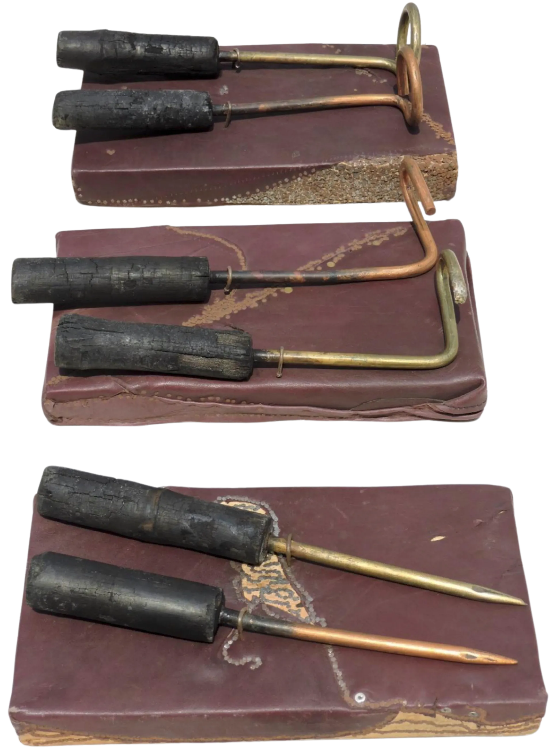Never being said C by Mithun Das - Iron nail, leather, copper, brass, and burnt wood